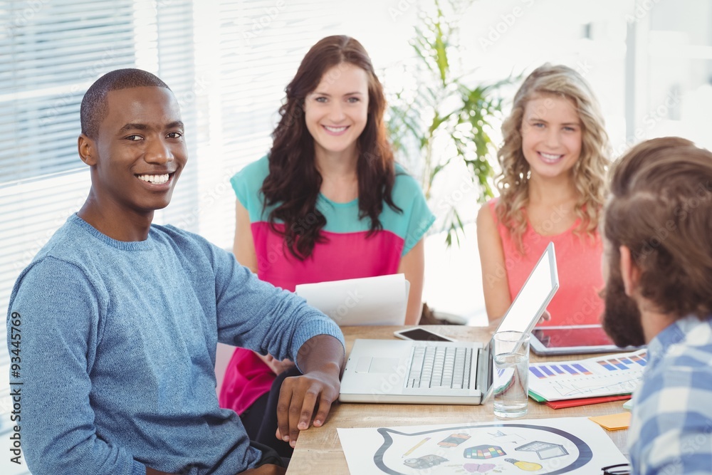Portrait of smiling business people sitting on chair Portrait of smiling business people sitting on chair