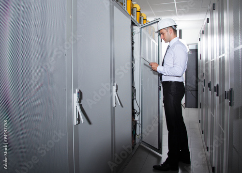 businessman using tablet server room © fotoinfot