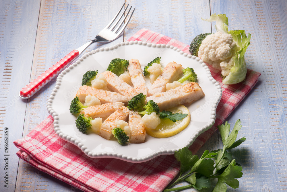 sliced swordfish with broccoli and cauliflower salad