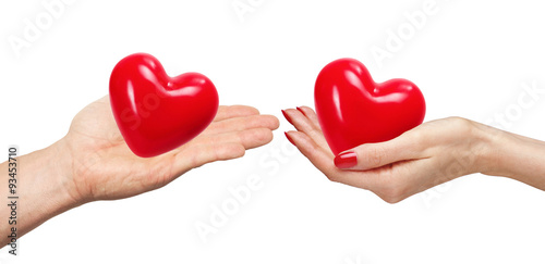 Loving couple holding hearts in hands isolated on white