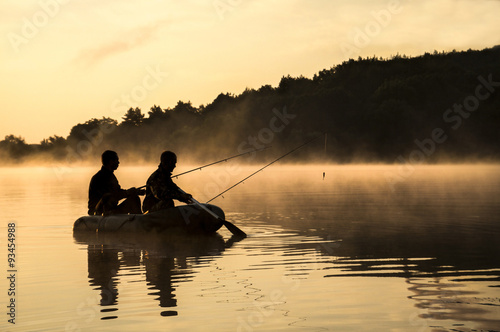 Fishermen in the boat sunrise