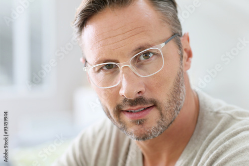 Fototapeta Naklejka Na Ścianę i Meble -  Portrait of handsome 40-year-old man with eyeglasses