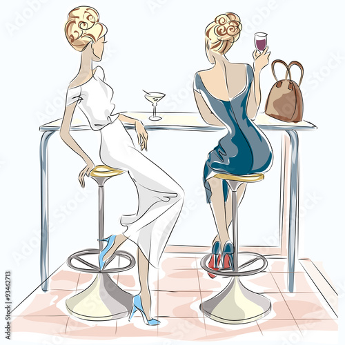 Two beautiful women sitting in cafe drinking cocktail and wine