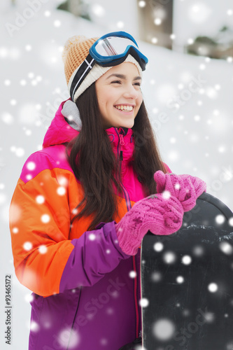 happy young woman with snowboard outdoors © Syda Productions