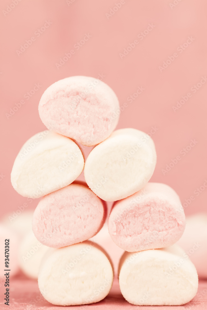 sweet marshmallows on a pink background