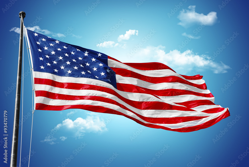 Naklejka premium American flag on blue sky with beauty clouds