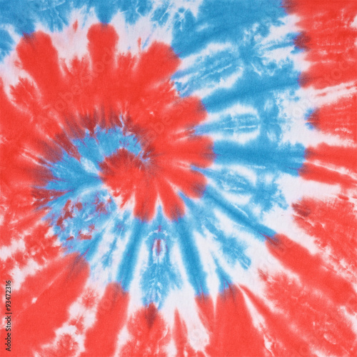 close up shot of red, white and light blue color tie dye fabric texture background in square ratio