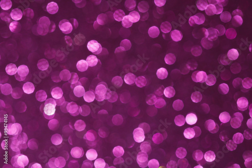 Violet glittering lights. Blurred abstract background