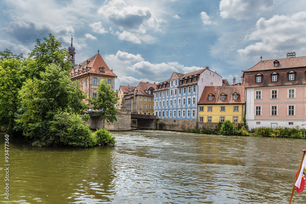 Bamberg. A scenic view of the Regnitz river with the Old Town Hall and the old buildings on the left bank