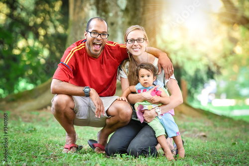 Happy interracial family is enjoying a day in the park