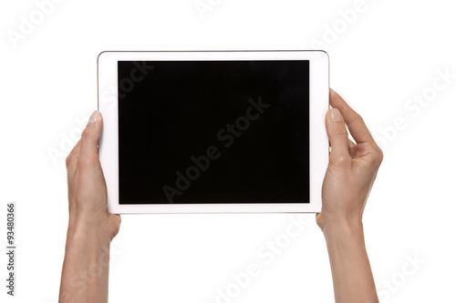 Tablet in hands. Studio shot isolated on white. 