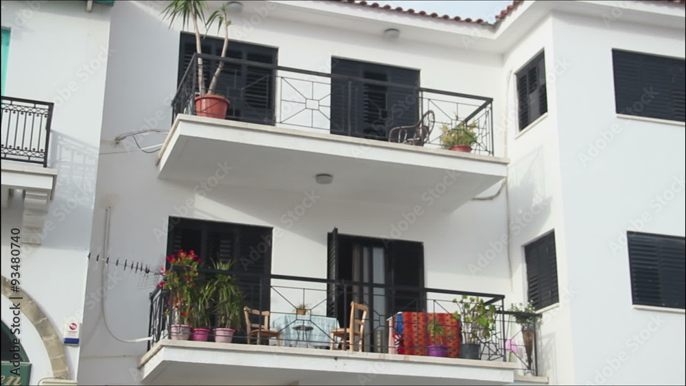 Establishing shot, panorama view, nice luxury villa with balconies, resort town Establishing shot, panorama view, nice luxury villa with balconies, resort town
