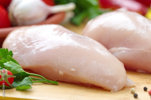 Raw chicken fillet with vegetables prepared for cooking