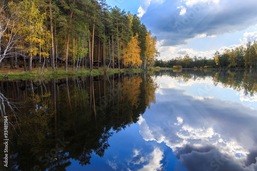 Fototapeta Naklejka Na Ścianę i Meble -  golden autumn, birches' reflection in the water, trees reflection in the river on sunrise, golden fall sunrise in forest