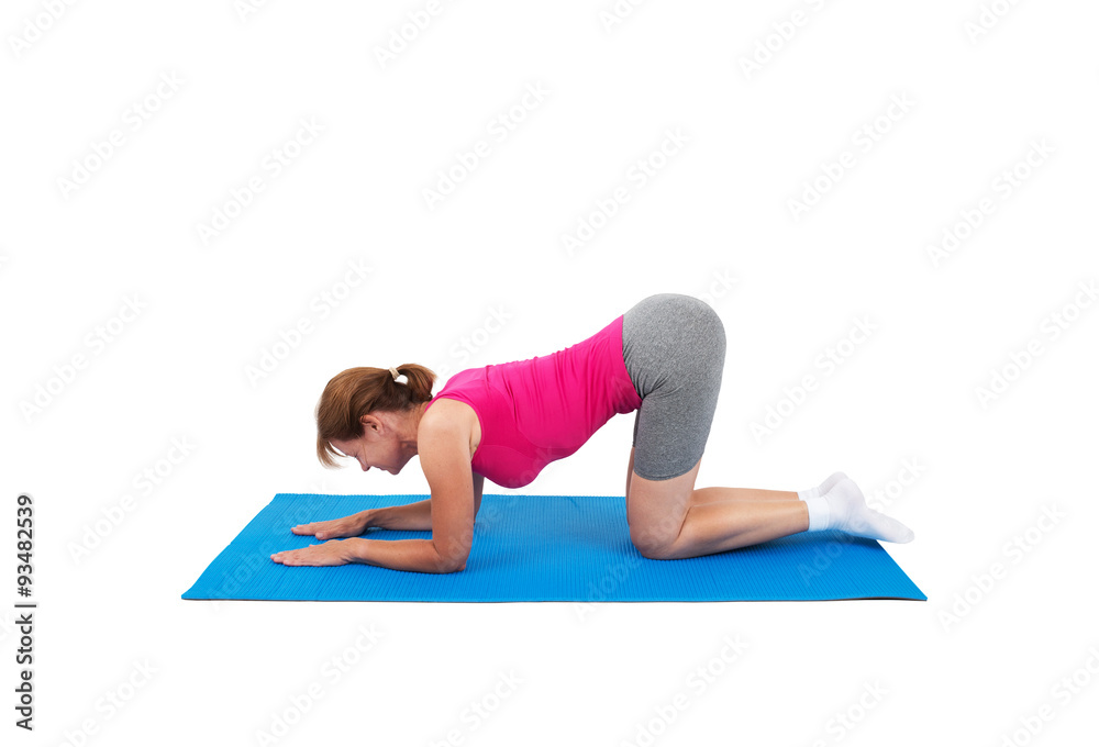 Woman doing gymnastics - hollow back exercise Woman doing gymnastics - hollow back exercise