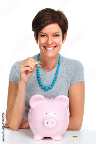 Elderly woman with piggy bank. photo