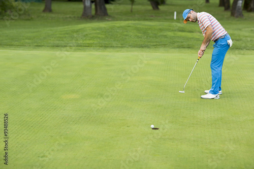 Young man playing golf