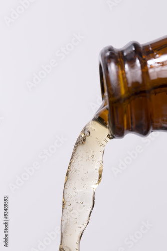 Beer Pouring out of Bottle