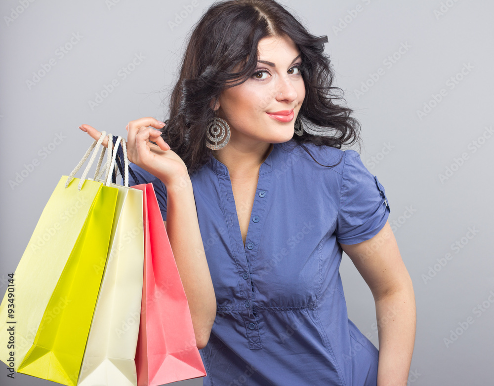 beautiful brunette in blue dress from the store. Girl with colorful packages
beautiful brunette in blue dress from the store. Girl with colorful packages