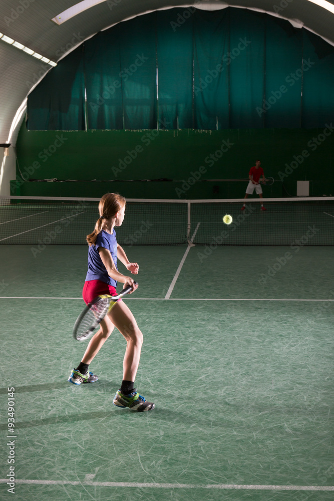 Young girl playing tennis Young girl playing tennis