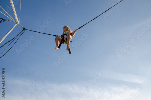 brave kid jumping high up in skies