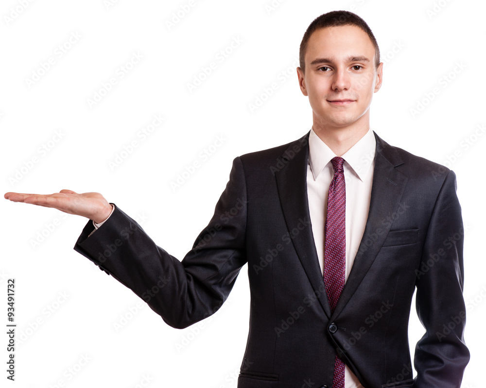 Businessman pointing to copy space, isolated on white background Businessman pointing to copy space, isolated on white background