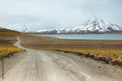View of dirt road and Miscanti lagoon in Sico Pass photo