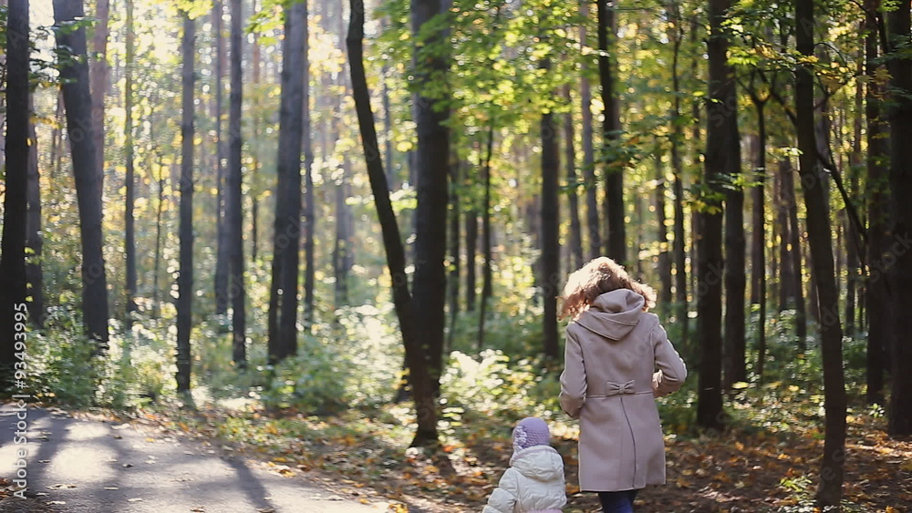 Mother and child walking in park Mother and child walking in park