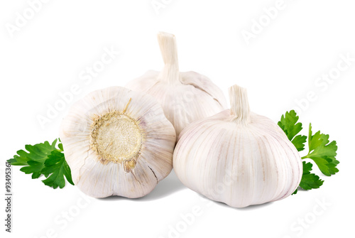 garlic with parsley leaves on a white background