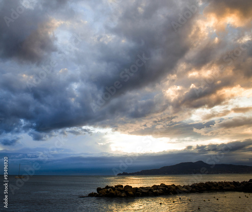 stormy sunset to the beach