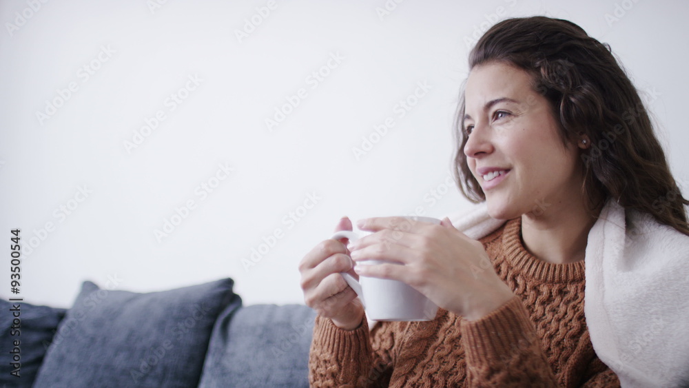 4K Attractive woman relaxing on couch with hot drink, shot on Red Epic Dragon 4K Attractive woman relaxing on couch with hot drink, shot on Red Epic Dragon