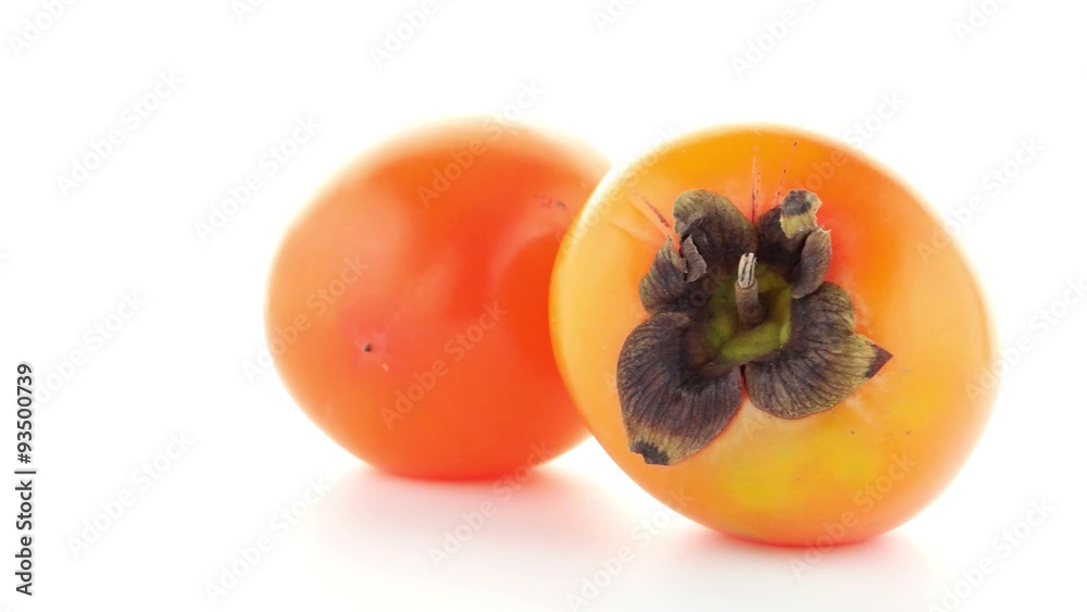 Red ripe persimmons rotating over white background. Red ripe persimmons rotating over white background.