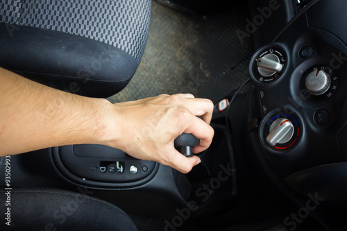 man hand Move Gear. Car interior detail.