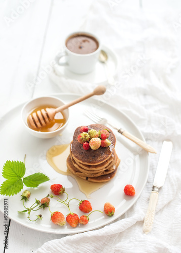 Breakfast set. Buckwheat pancakes with fresh garden strawberries