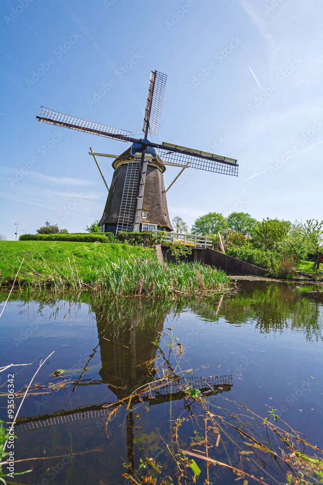 Vintage Windmill near Lake, Netherlands