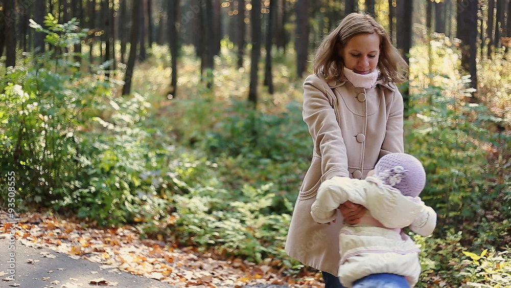 Mother and child walking in park Mother and child walking in park