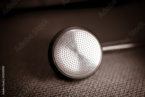 Black ear bud on black background, Selective focus and Close up detail image