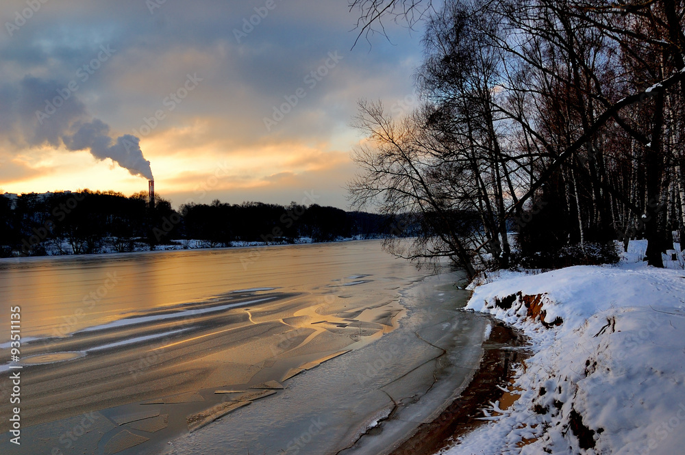 Slightly technogenic landscape in winter. Pipe factory near the Park. Moscow, Russia Slightly technogenic landscape in winter. Pipe factory near the Park. Moscow, Russia