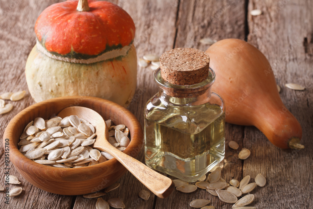 pumpkin seed oil in a bottle closeup on the table. horizontal
pumpkin seed oil in a bottle closeup on the table. horizontal