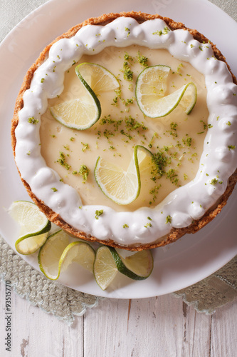 key lime pie with whipped cream close-up. vertical top view 