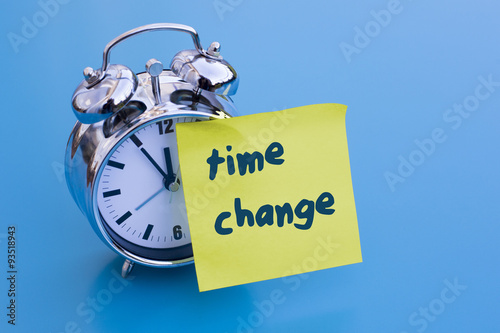 alarm clock with note 'time change'