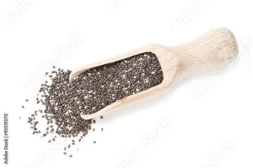 chia seeds in a wooden scoop on wood cup ,isolated