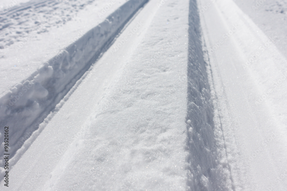 sports cross country skiing loipe in fresh snow on a road sports cross country skiing loipe in fresh snow on a road