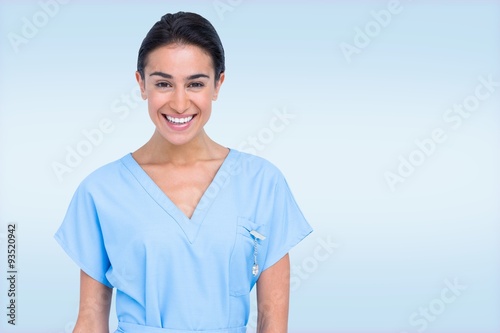 Composite image of young nurse in blue tunic  photo