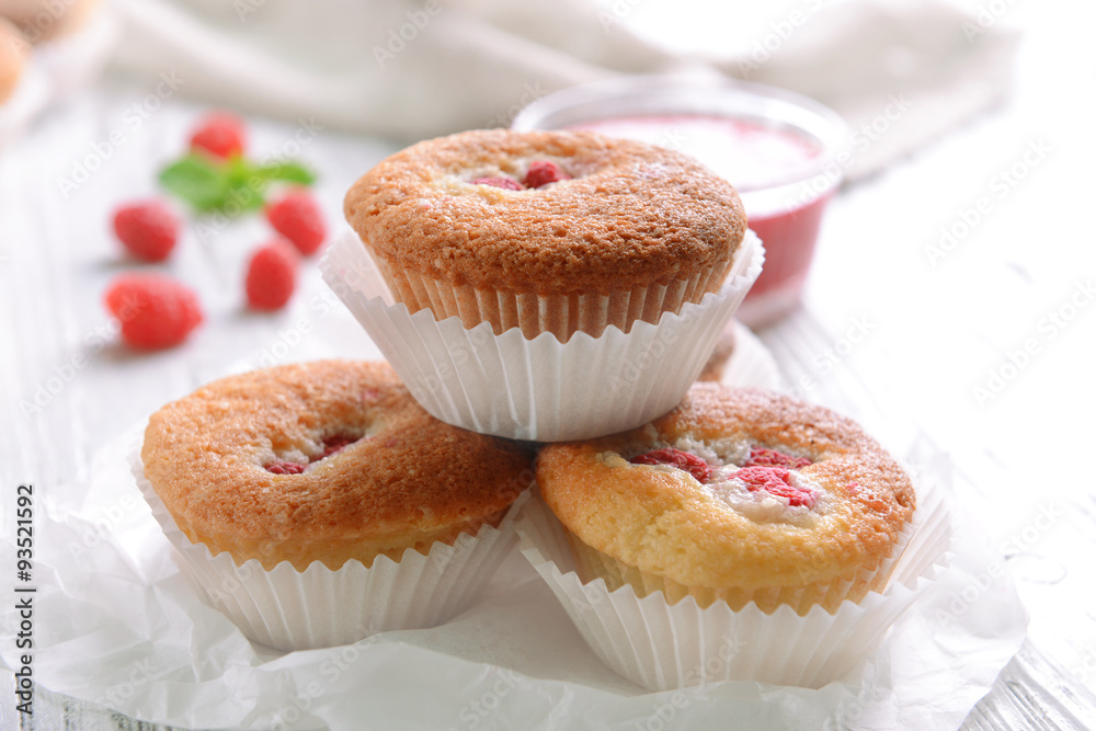 Delicious cupcakes with berries on table close up Delicious cupcakes with berries on table close up