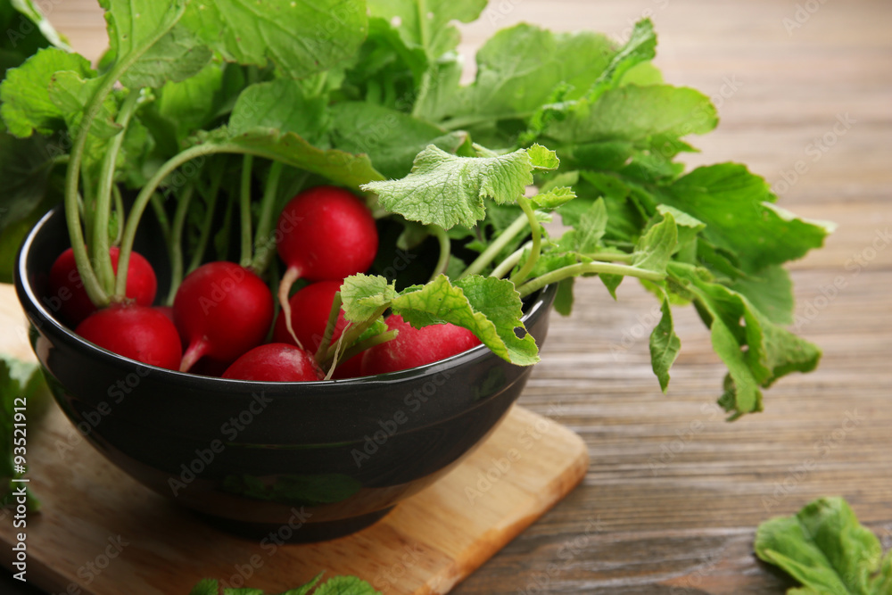 Fresh red radish on wooden table, closeup Fresh red radish on wooden table, closeup
