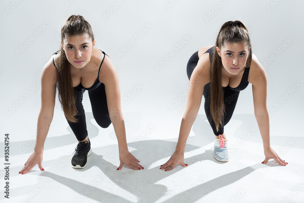 Fototapeta premium Twin fitness sisters