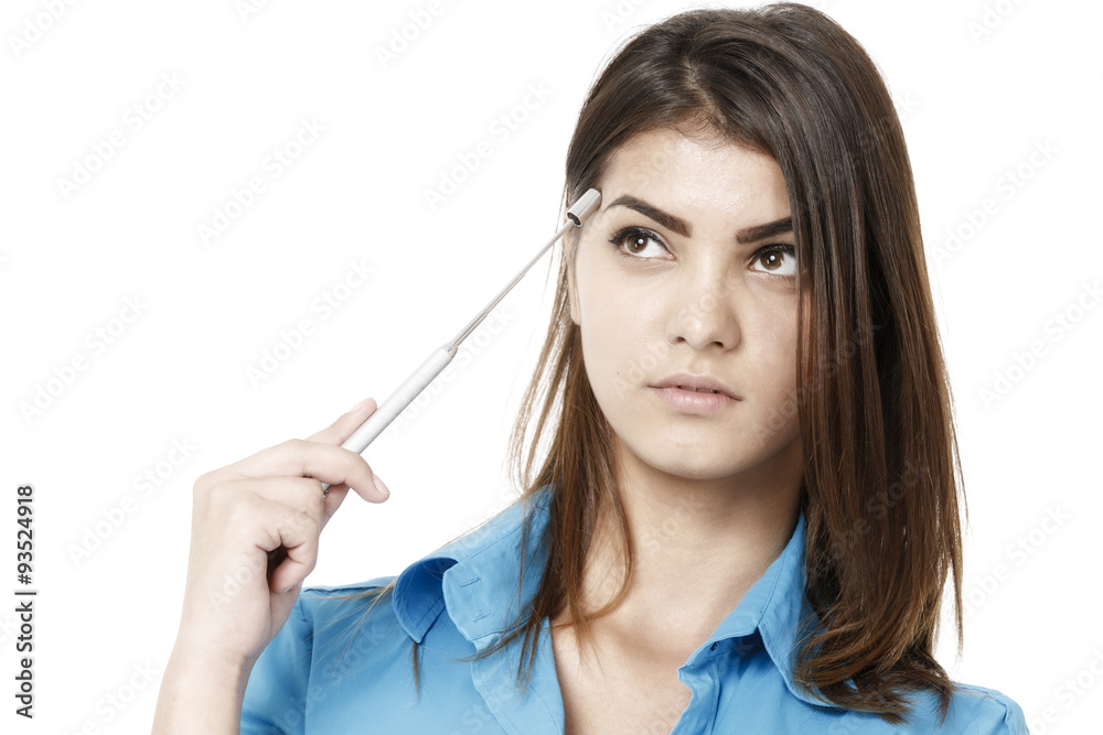 Portrait of a beautiful young business woman thinking against