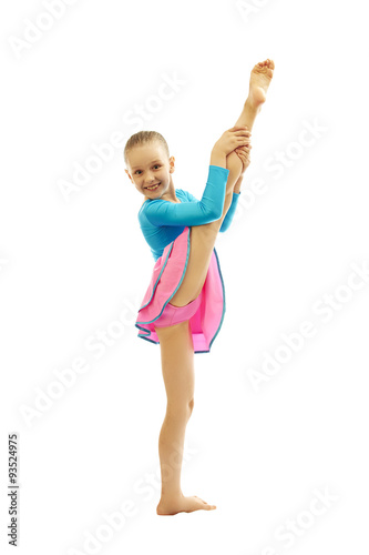 young  girl doing gymnastics exercises