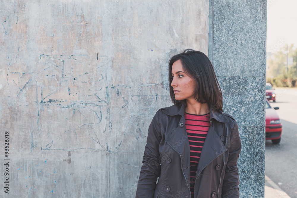 Beautiful girl posing in an urban context